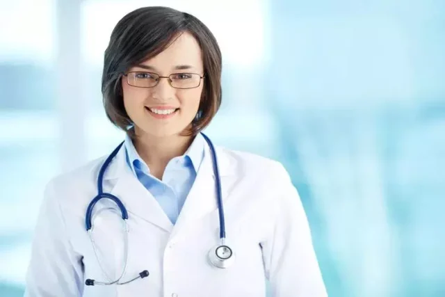 white Nurse with stethoscope standing