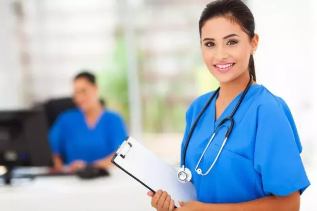 nurse in blue dress with stethoscope