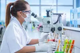 nurse student examining microorganisms